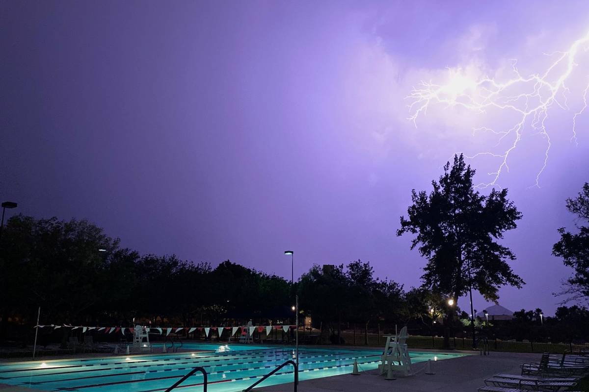 Lightning illuminates the sky above the Trails Pool in Summerlin on Tuesday, July 20, 2021. (Co ...