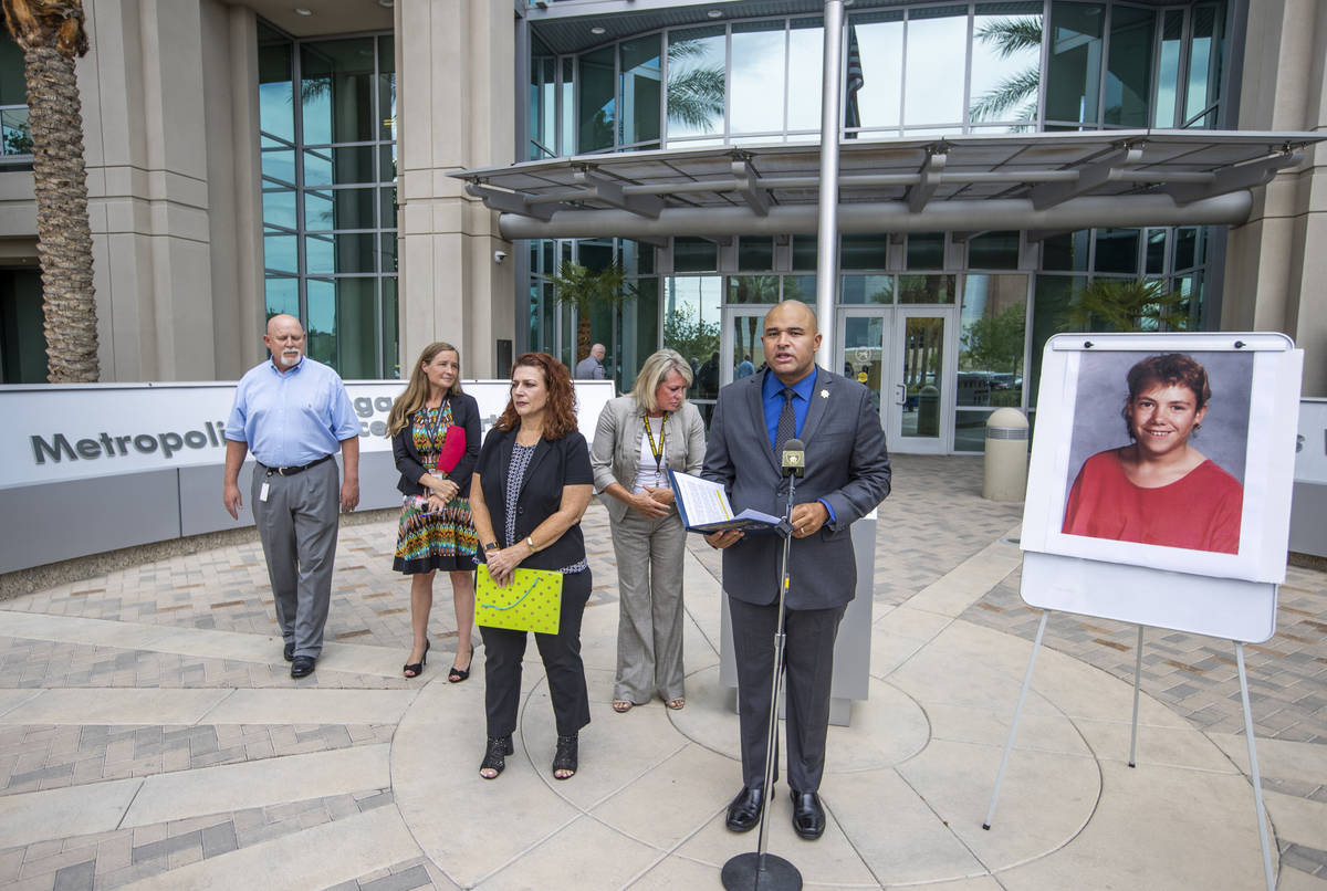 Homicide Lt. Ray Spencer, center, conducts a press conference beside a photo of Stephanie Ann I ...