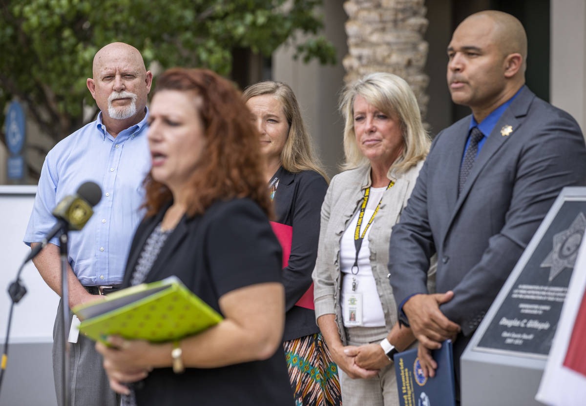 Cold Case Detective Dan Long, from left, listens in as Forensics Director Kim Murga speaks bes ...