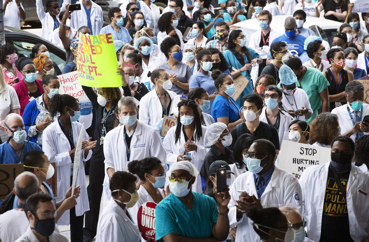FILE - In this June 4, 2020, file photo, health care workers at Brooklyn's Kings County Hospita ...