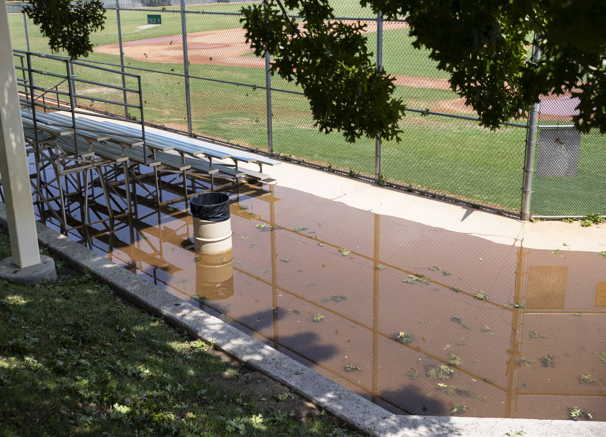 Baseball bleachers at Arroyo Grande Sports Complex are surrounded by flood water, on Friday, Ju ...