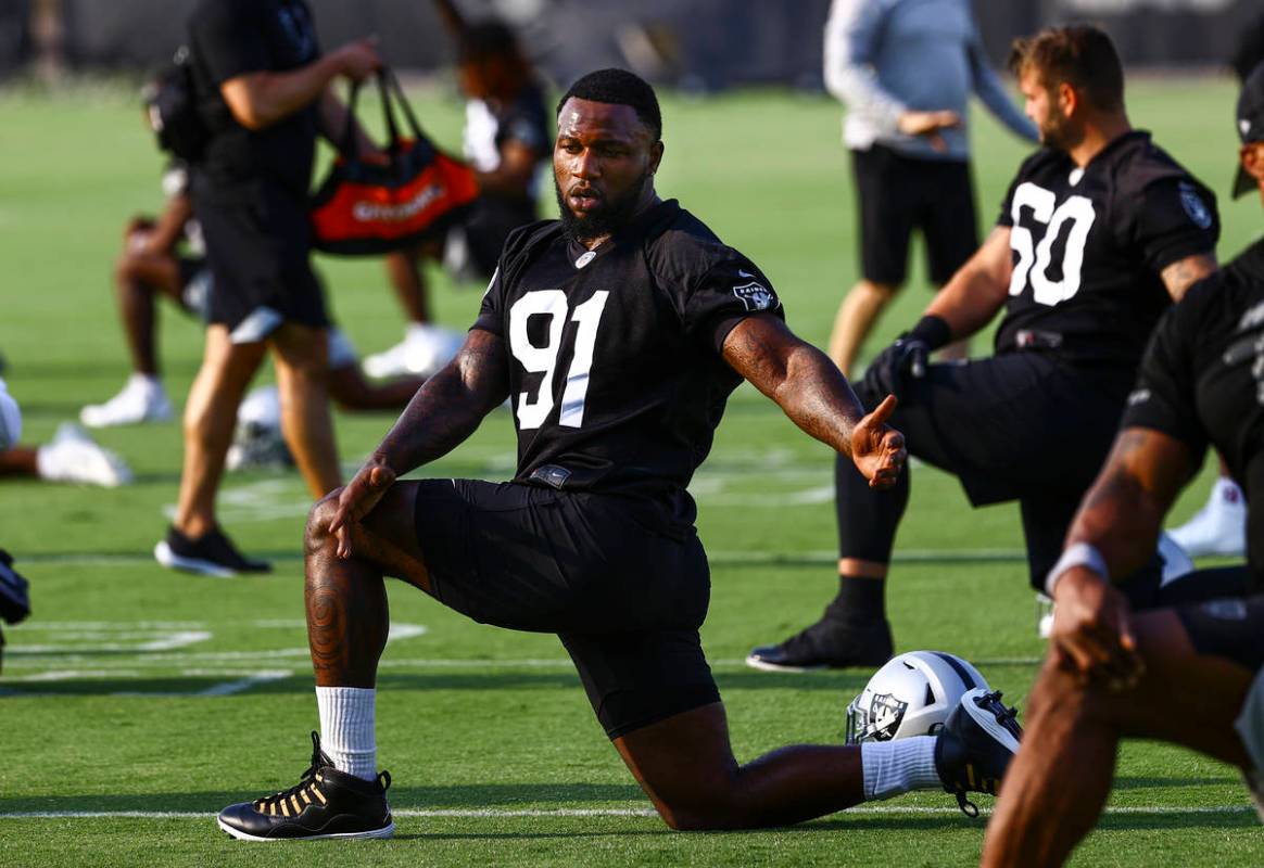 Raiders defensive end Yannick Ngakoue (91) stretches during an NFL football minicamp at Raiders ...