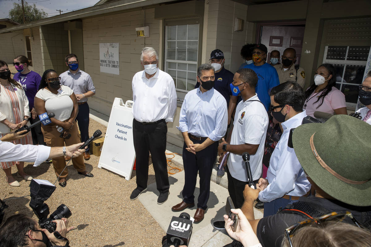 Nevada Governor Steve Sisolak, from left, Health and Human Services Secretary Xavier Becerra, C ...