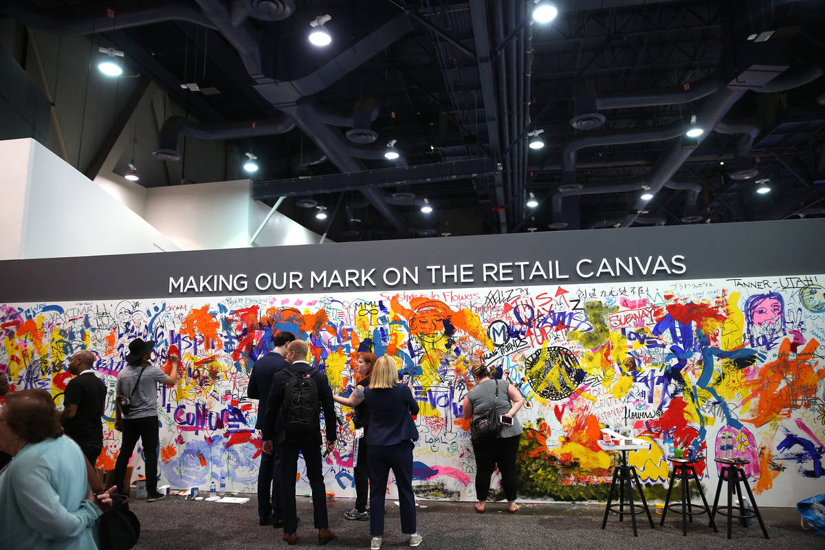 People attend RECon expo at the Las Vegas Convention Center in Las Vegas, Tuesday, May 22, 2018 ...