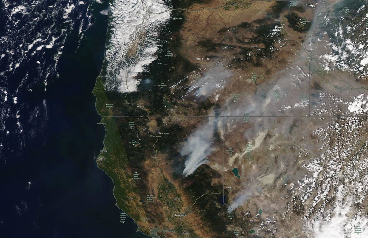This satellite image provided by Satellite image ©2021 Maxar Technologies shows the wildfi ...