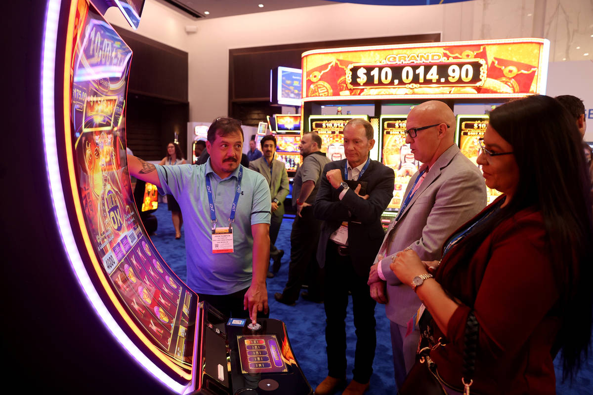 Jason Thompson, slot director at Spirit Lake Casino & Resort in Saint Michael, N.D., left, ...