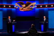 Moderator Chris Wallace of Fox News listens as President Donald Trump and Democratic candidate ...