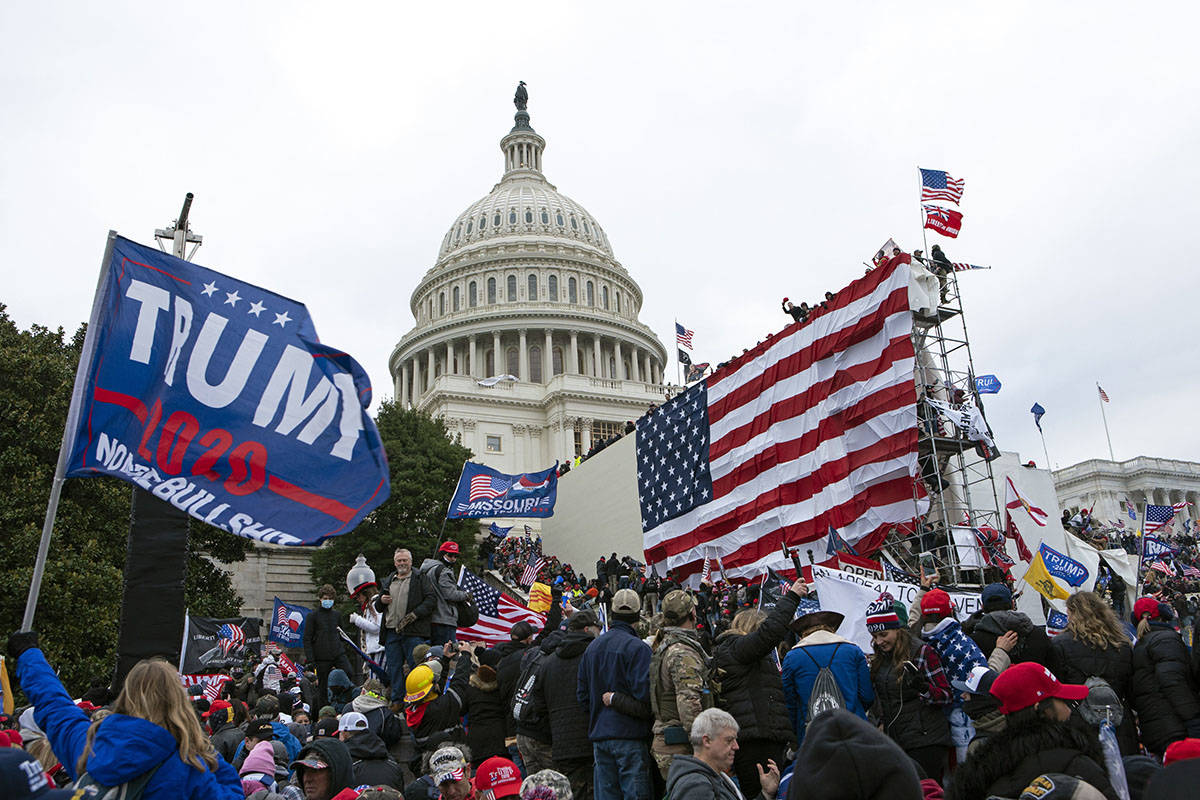 Rioters loyal to then-President Donald Trump outside of U.S. Capitol on Jan. 6, 2021, in Washi ...