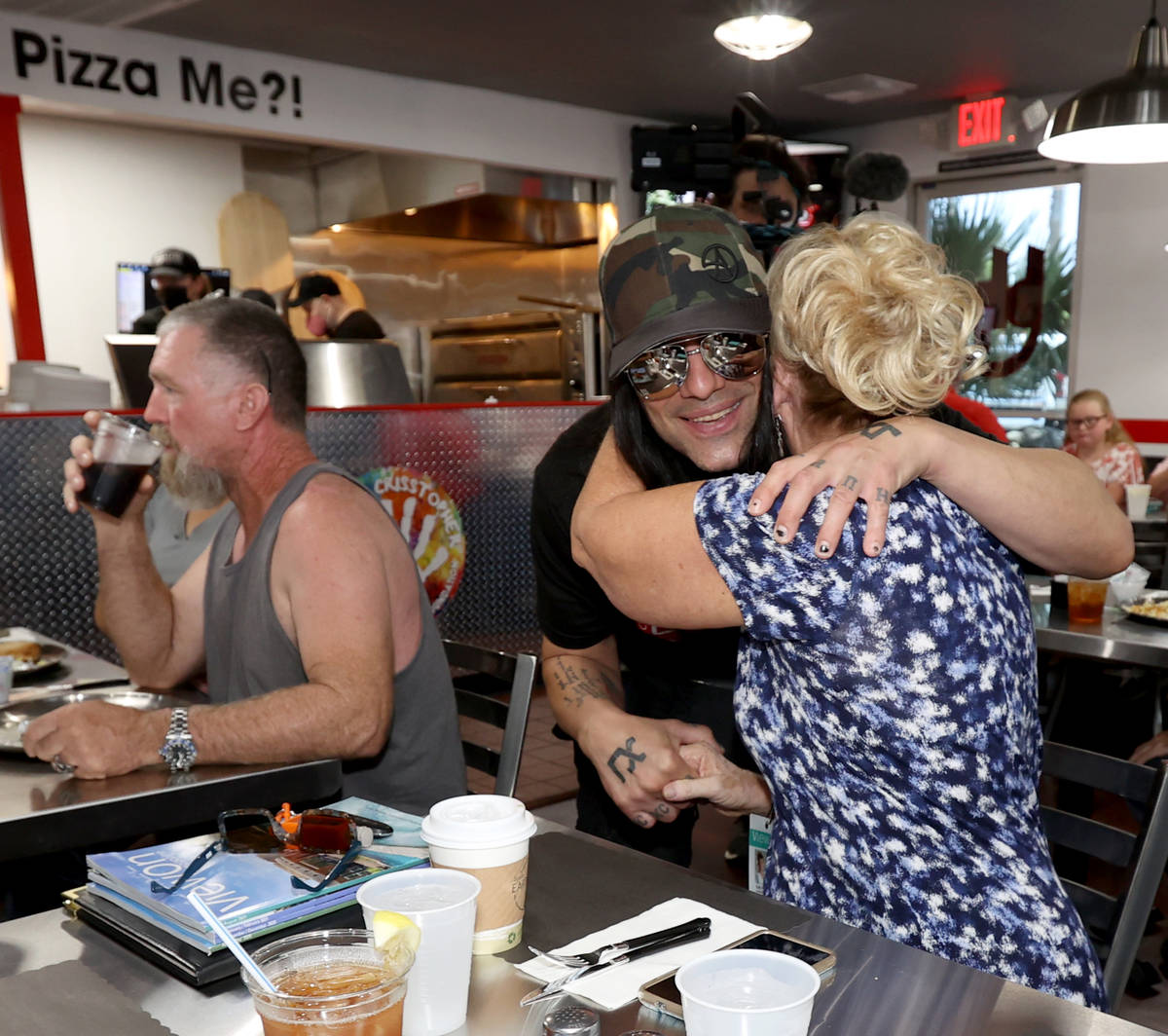Criss Angel greets Kathy Lee at his new restaurant, CABLP, in Overton during the grand opening ...