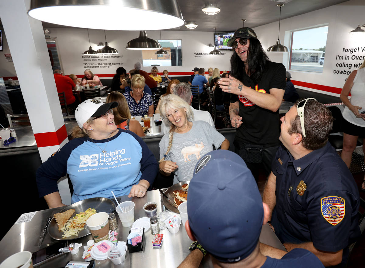 Criss Angel greets, from left, Shanna McPheters, Janice Ridondo, firefighter Greg Johnson and M ...