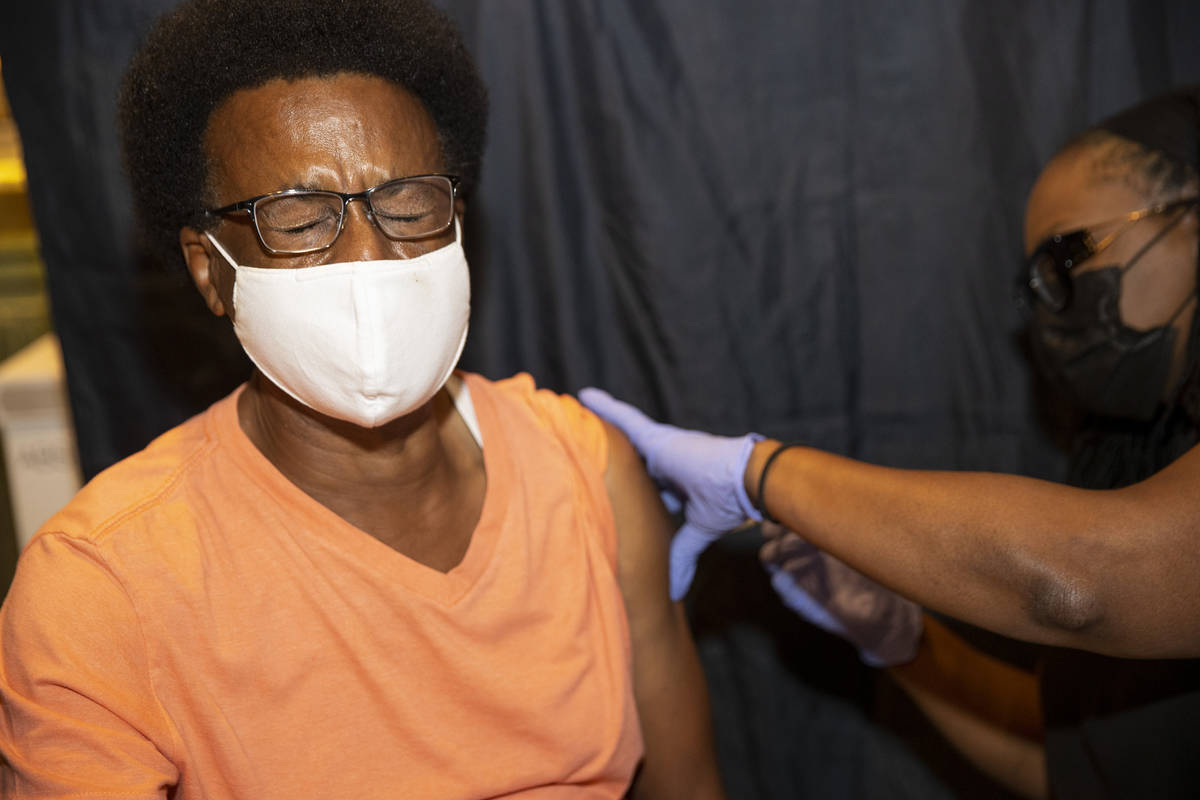 Michael Morrison of Las Vegas is vaccinated by registered nurse Barbara Gedeon during the #Viva ...