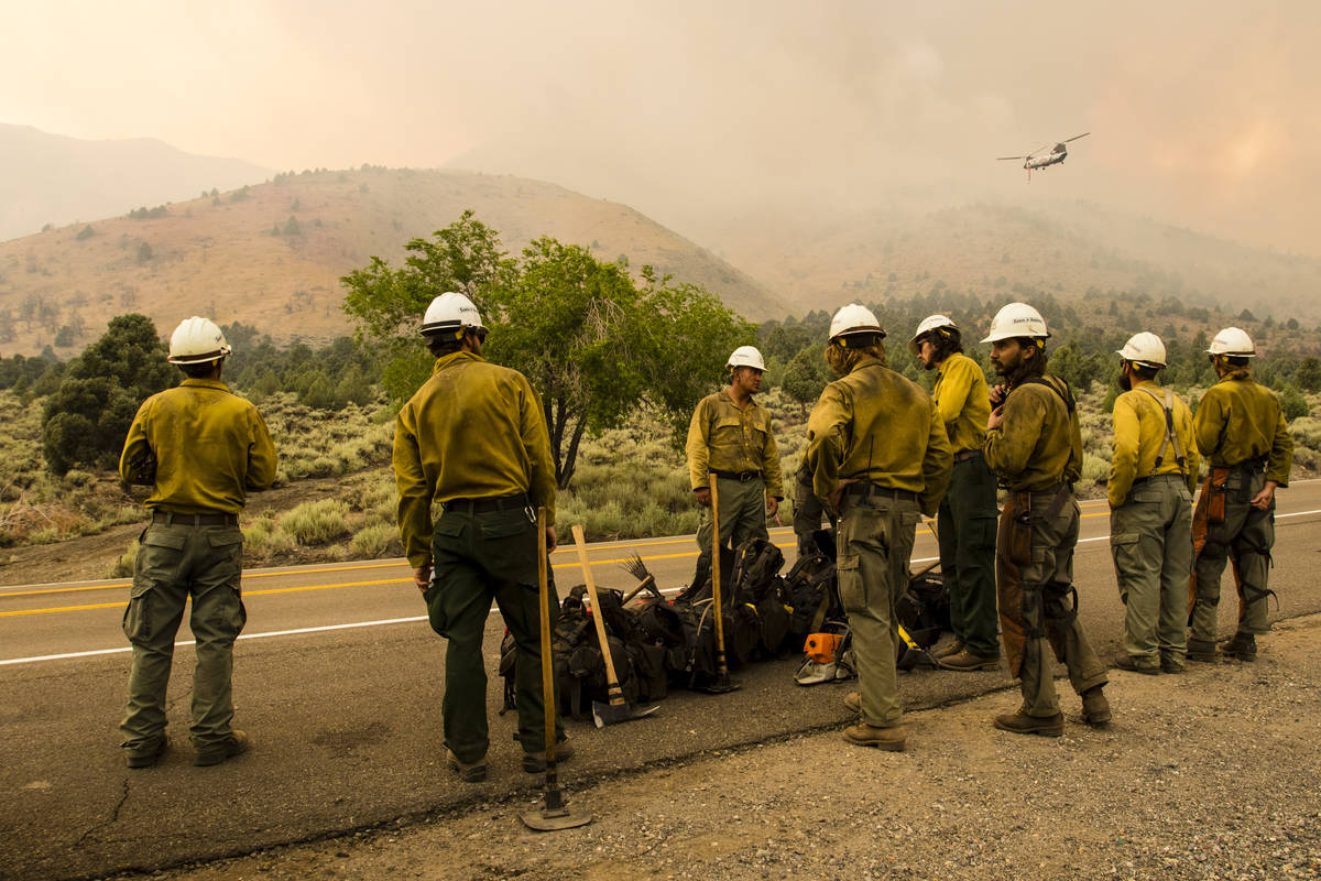 A Santa Fe Hotshots unit  gathers portion    battling the Tamarack Fire astir   Topaz Lake, Nev., Frid ...