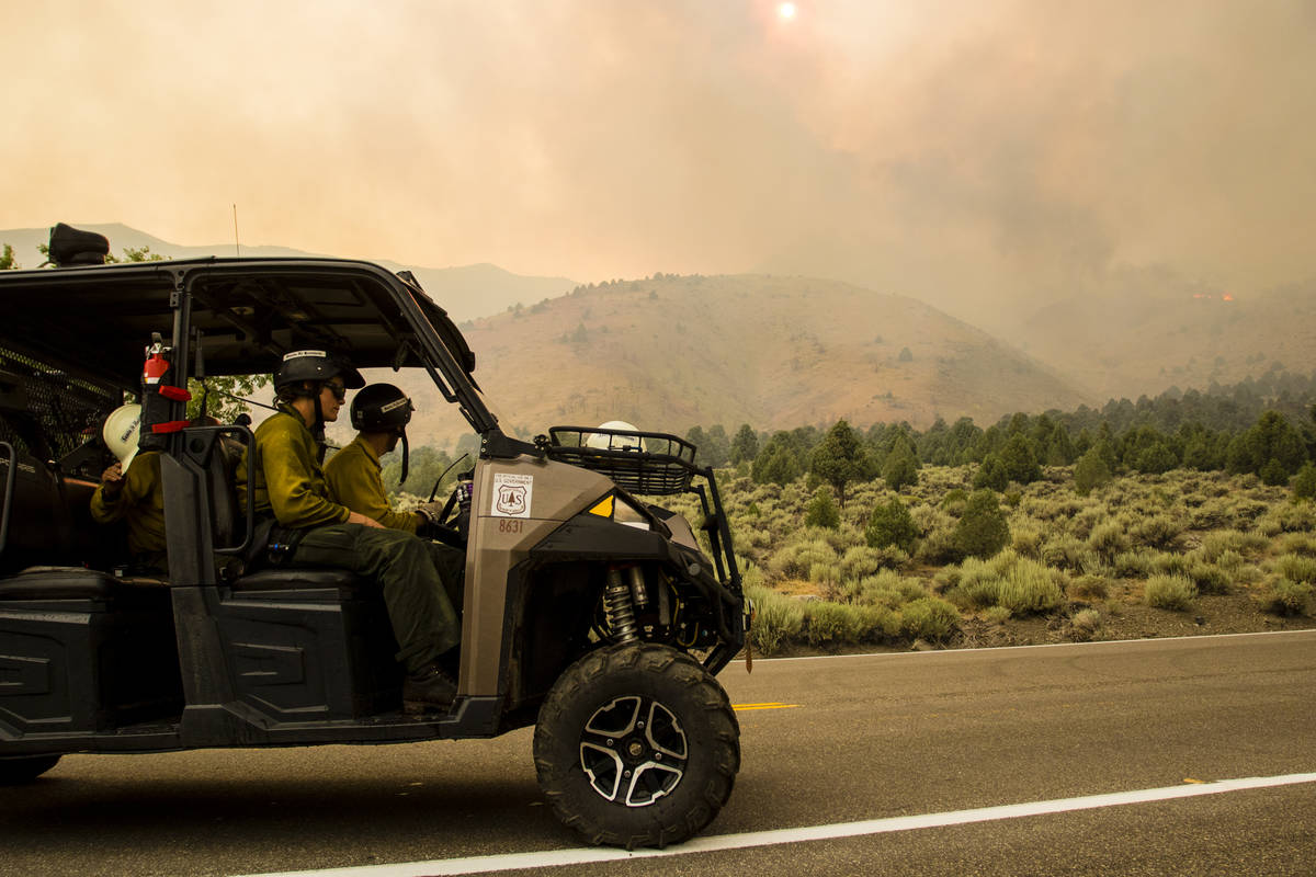 A Santa Fe Hotshots unit  drives astir   Topaz Lake, Nev., Friday, July 23, 2021, arsenic  battling th ...