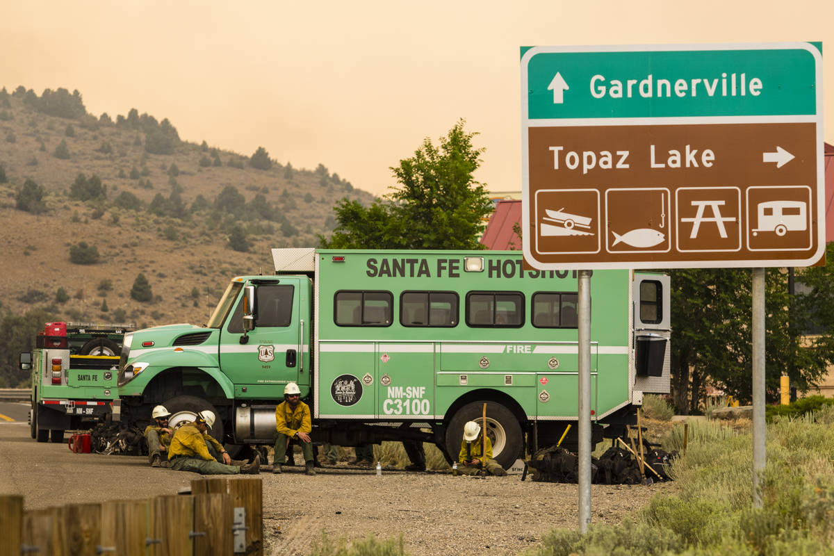 A Santa Fe Hotshots unit  is seen successful  Topaz Lake, Nev., Friday, July 23, 2021, portion    battling the ...