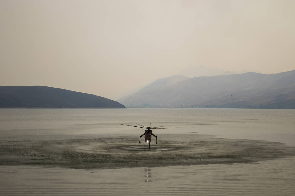 A firefighting chopper  is seen astatine  Topaz Lake, successful  Nevada, Friday, July 23, 2021, portion    the T ...