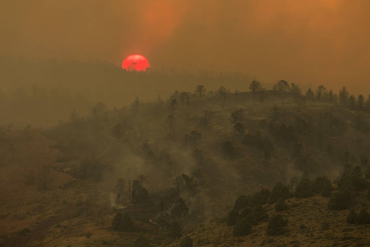 Sunset is seen arsenic  the Tamarack Fire burns astir   Topaz Lake, Nev., Friday, July 23, 2021.(Ty On ...