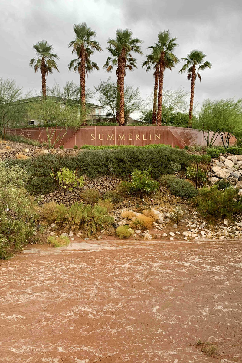 Flood waters along Charleston Boulevard near Red Rock Canyon National Conservation Area on Mond ...