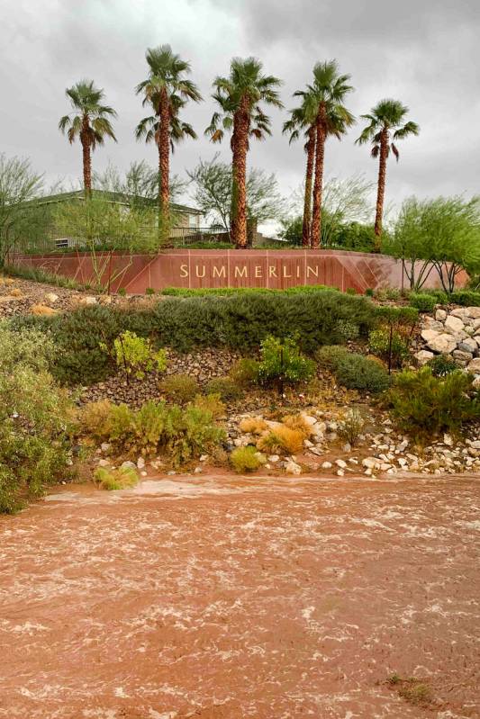 Flood waters along Charleston Boulevard near Red Rock Canyon National Conservation Area on Mond ...