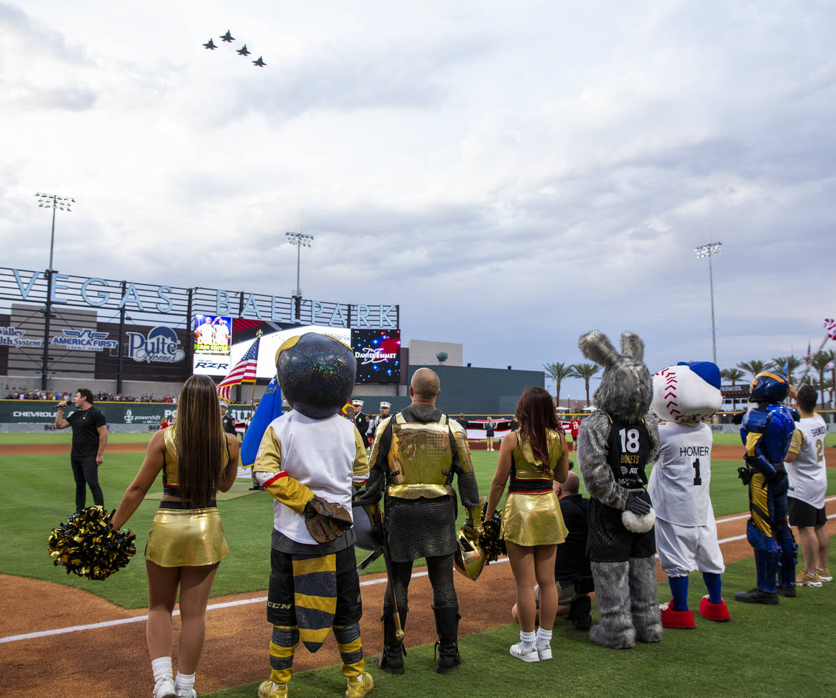 Nellis AFB F-35 jets fly over the Las Vegas Ballpark for a charity softball game involving pla ...