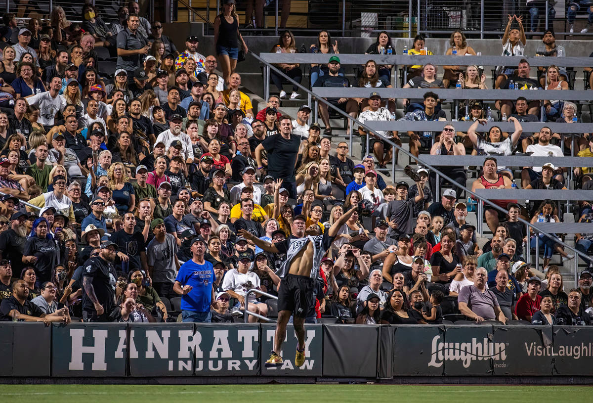 Las Vegas Raiders Johnathan Abram (24) goes up for a fly ball before the crowd during a charity ...