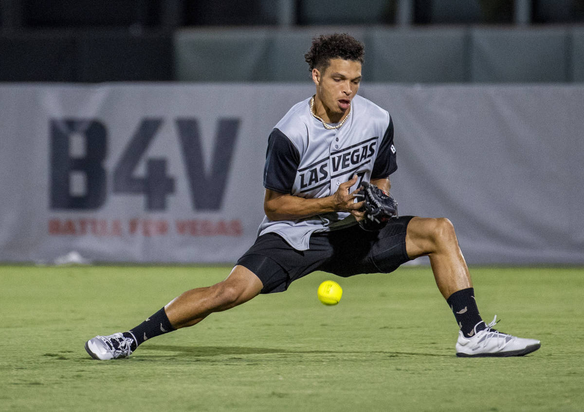 Las Vegas Raiders Willie Snead IV (17) loses a fly ball during a charity softball game versus t ...