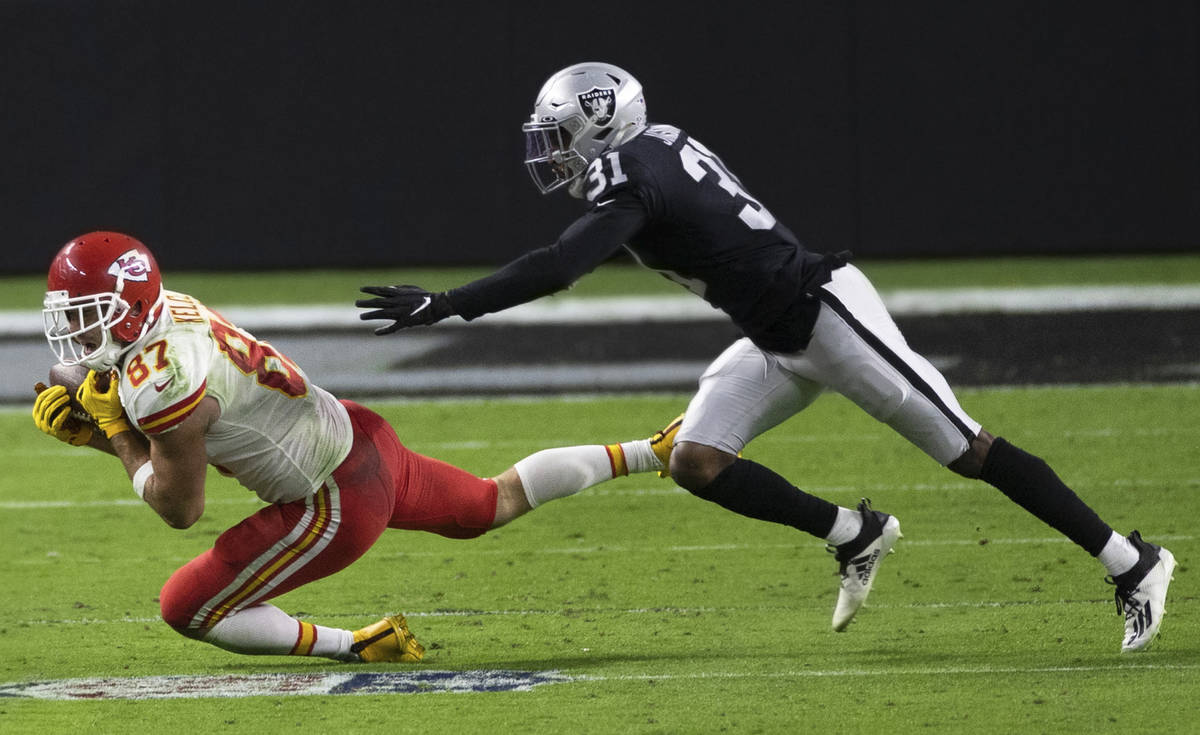 Kansas City Chiefs tight end Travis Kelce (87) makes a diving catch past Las Vegas Raiders corn ...