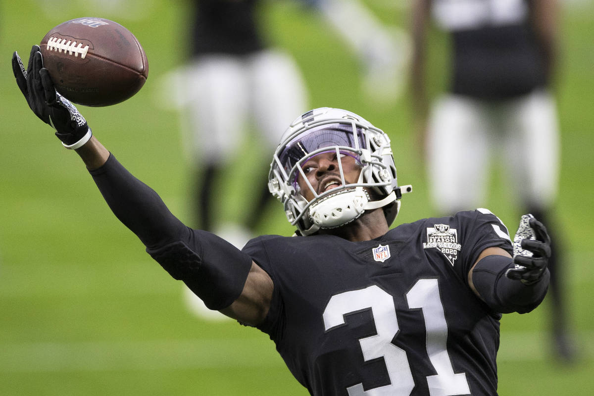Raiders cornerback Isaiah Johnson (31) catches a pass during warm ups before the start of an NF ...