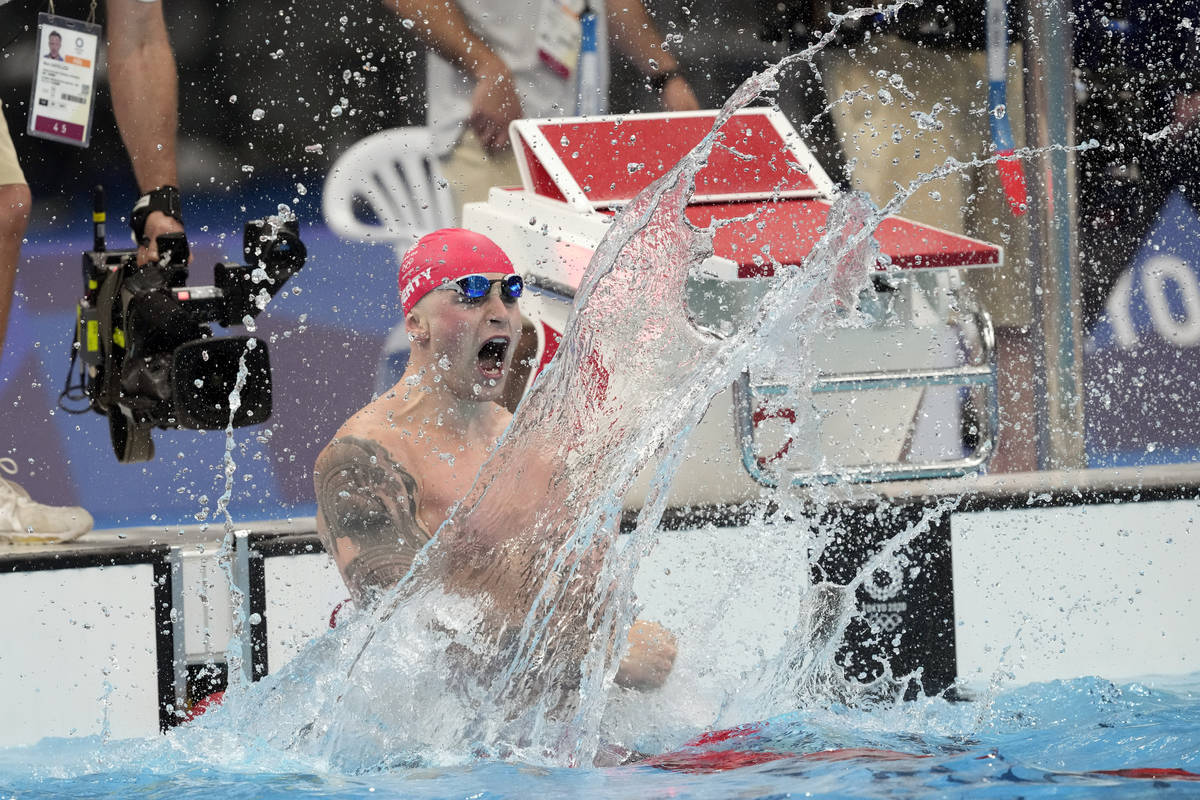 Adam Peaty, of Britain, celebrates aft  winning the last  of the men's 100-meter breaststroke ...