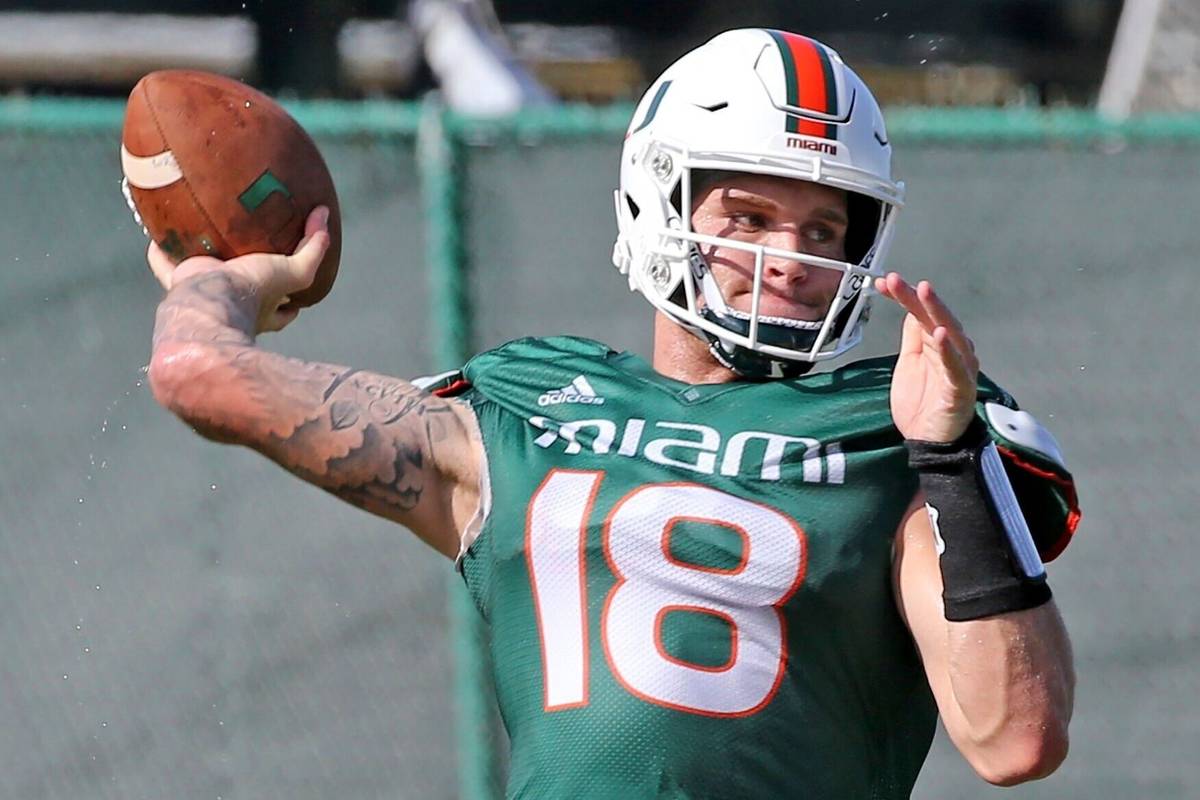 Miami quarterback Tate Martell (18) throws the ball during NCAA college football practice in Co ...