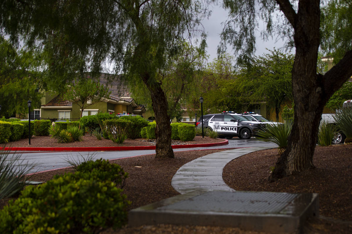 Police investigate a homicide Monday, July 26, 2021, on the 2600 block of South Pavilion Center ...