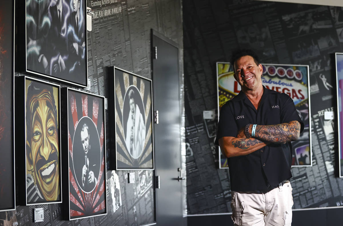 Artist Michael Godard, who curated the Allegiant Stadium art collection, poses for a portrait i ...