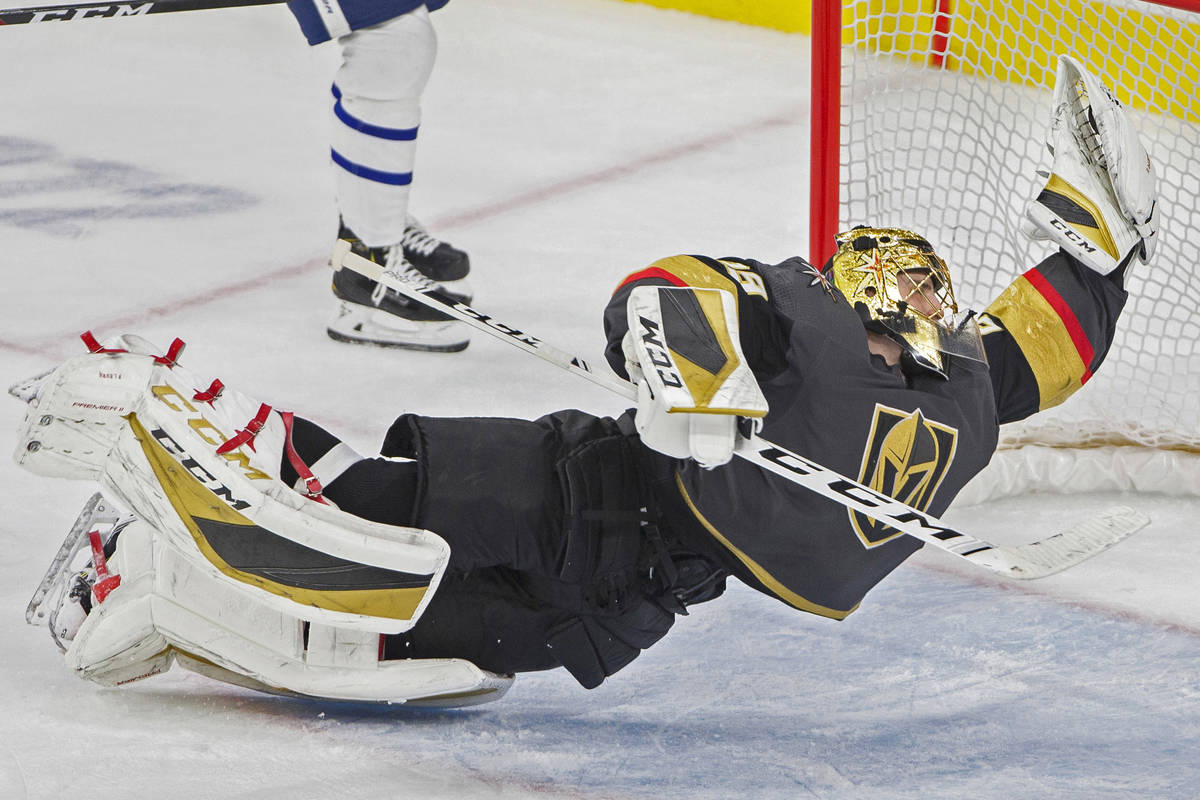 Golden Knights goaltender Marc-Andre Fleury (29) makes a diving save in the third period during ...