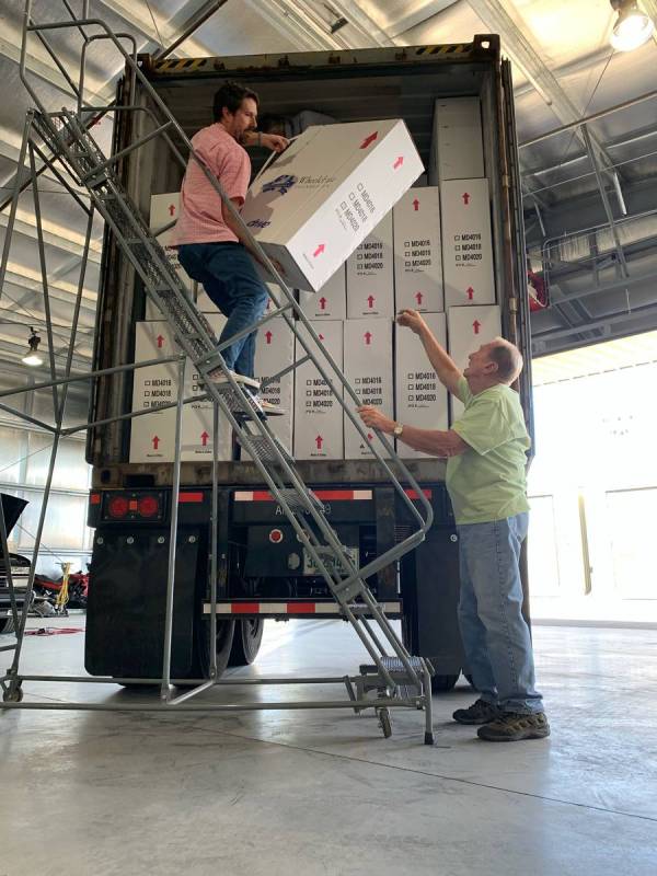 Volunteers unload wheelchairs that will be donated to Nevadans in need. The Wheelchair Foundati ...