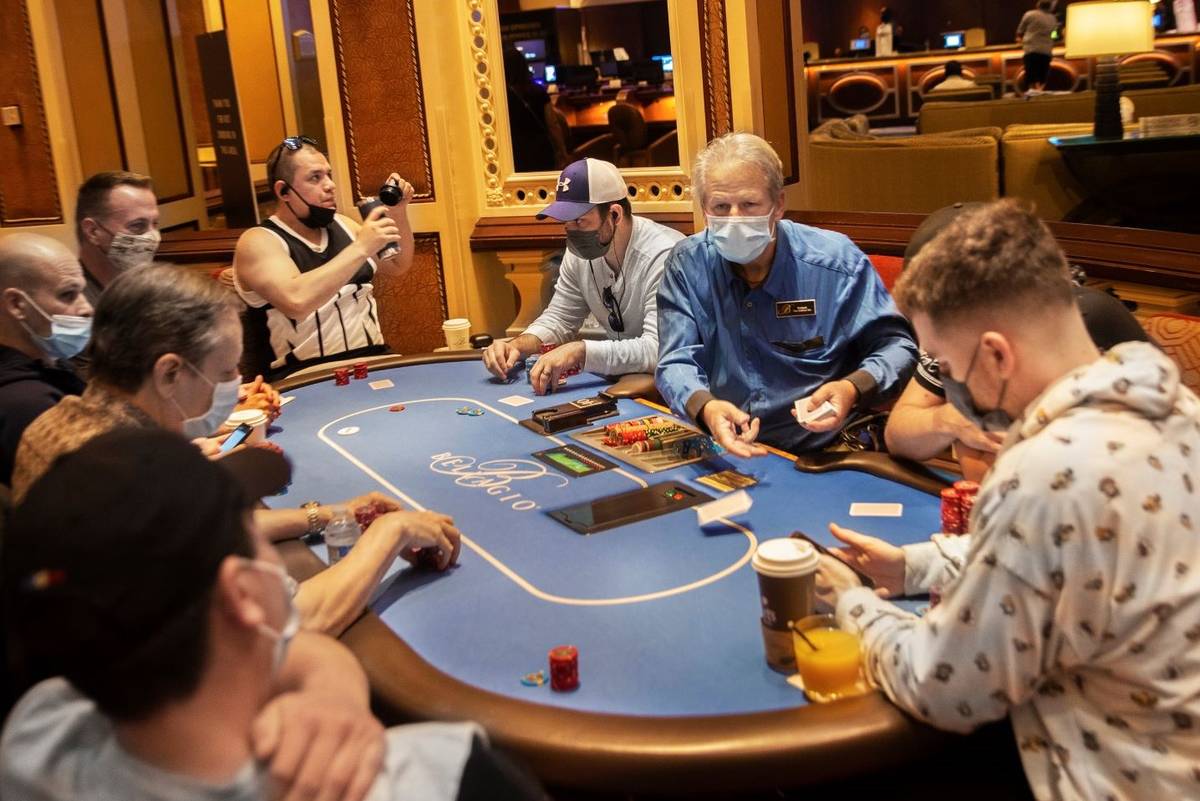 The poker tables at Bellagio are packed on Friday, May 14, 2021, in Las Vegas. (Benjamin Hager/ ...