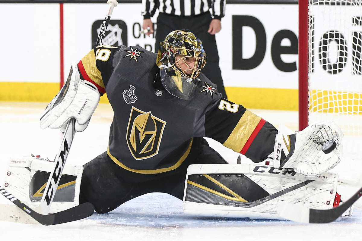 Golden Knights goaltender Marc-Andre Fleury (29) blocks a shot from Washington Capitals center ...