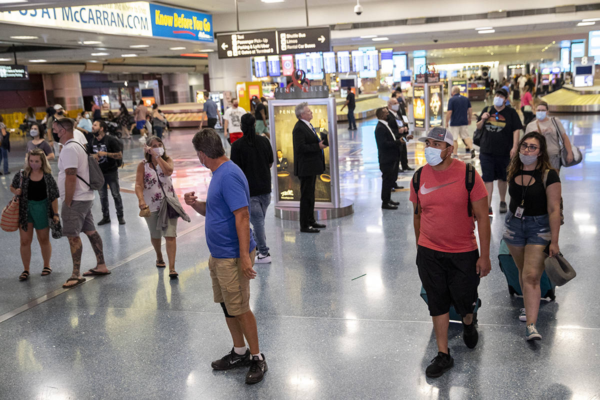 People arrive at McCarran International Airport Terminal 1 in Las Vegas, Friday, July 2, 2021. ...