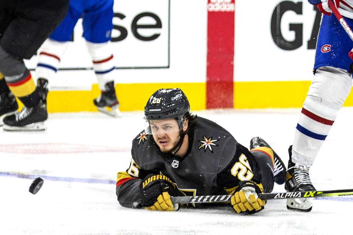 Golden Knights center Mattias Janmark (26) looks to a puck that just gets away on a drive to th ...
