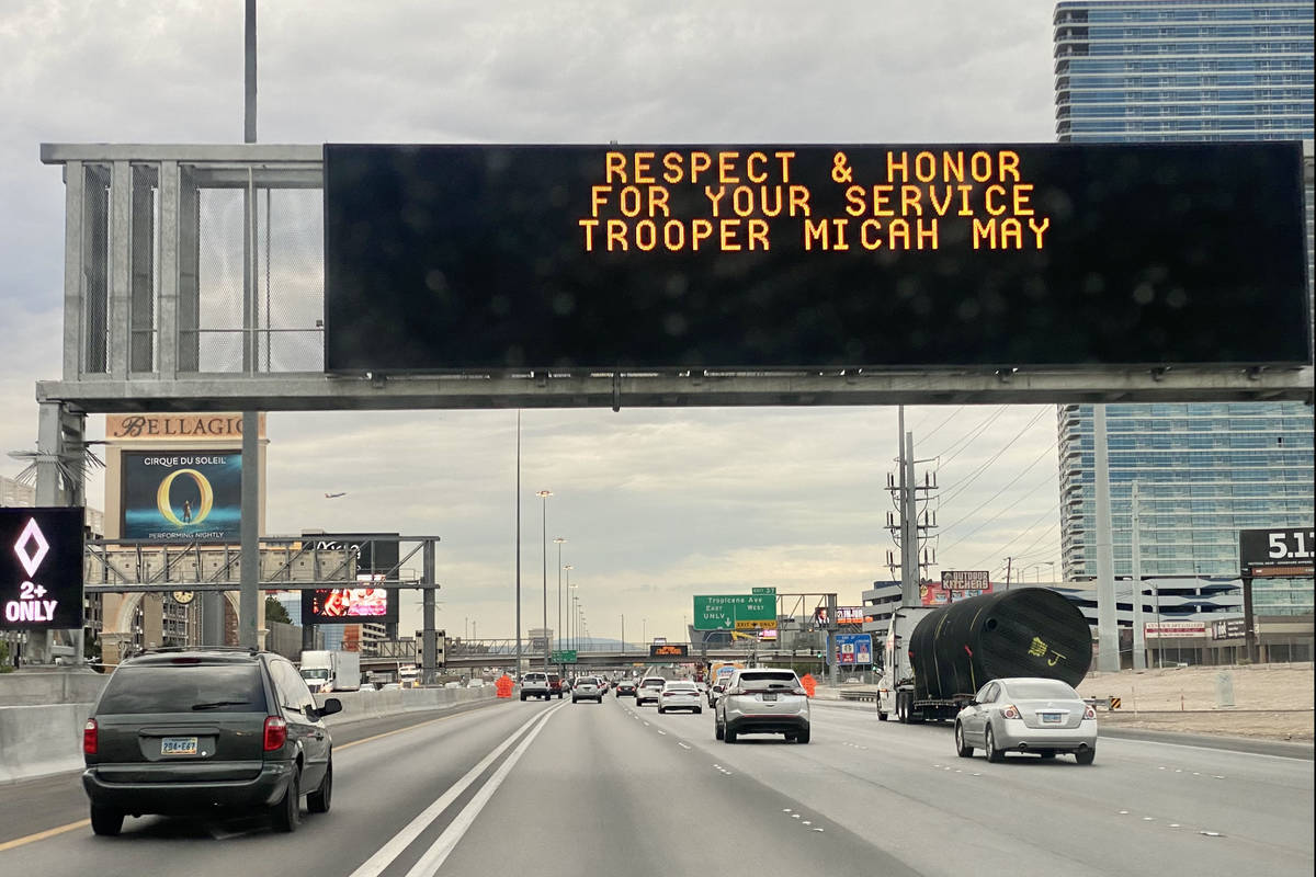 A sign for Nevada Highway Patrol trooper Micah May is seen on southbound Interstate 15 in Las V ...