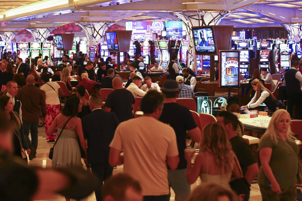 People gamble on the casino floor as Resorts World Las Vegas opens to the public on Thursday, J ...