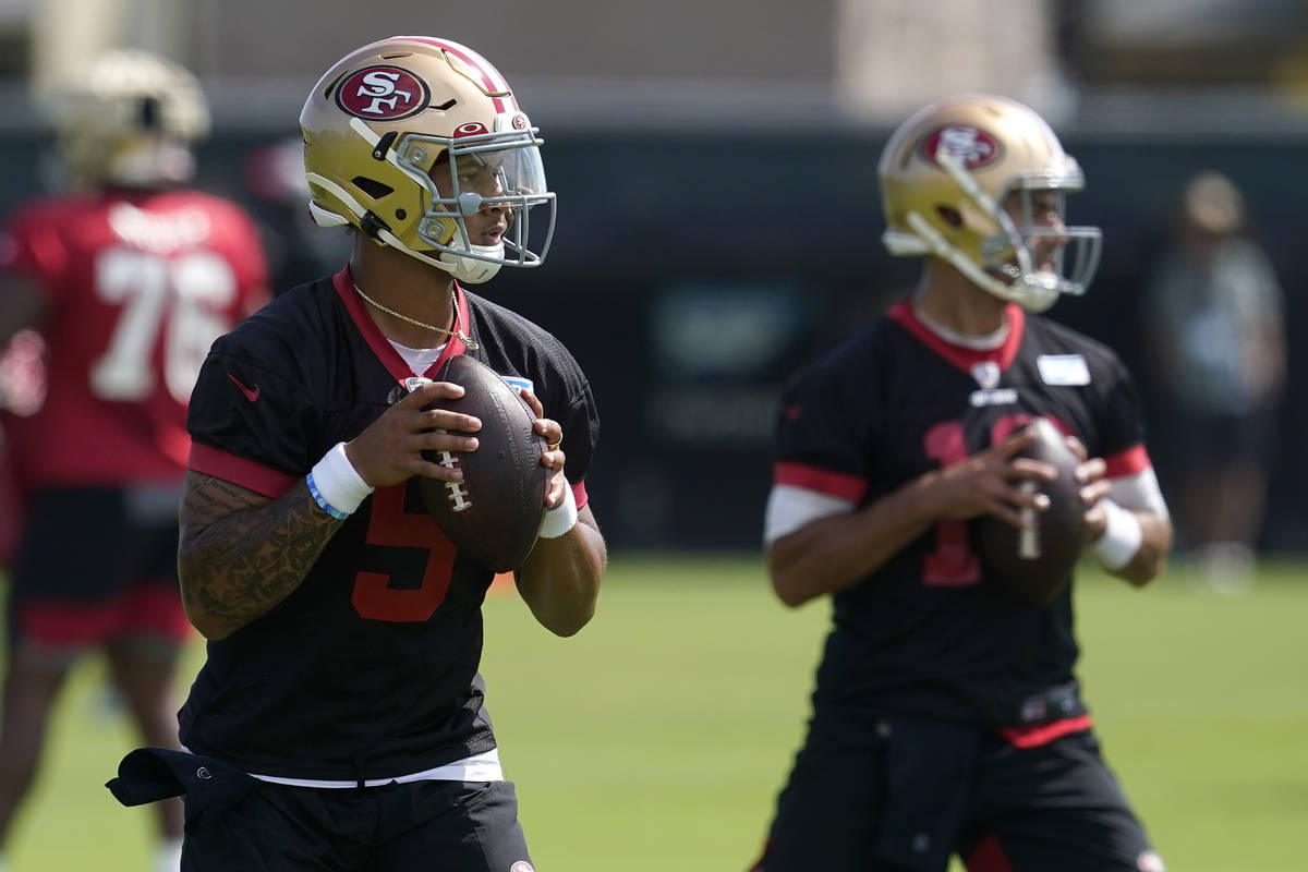 San Francisco 49ers quarterbacks Trey Lance, left, and Jimmy Garoppolo throw passes at NFL foot ...