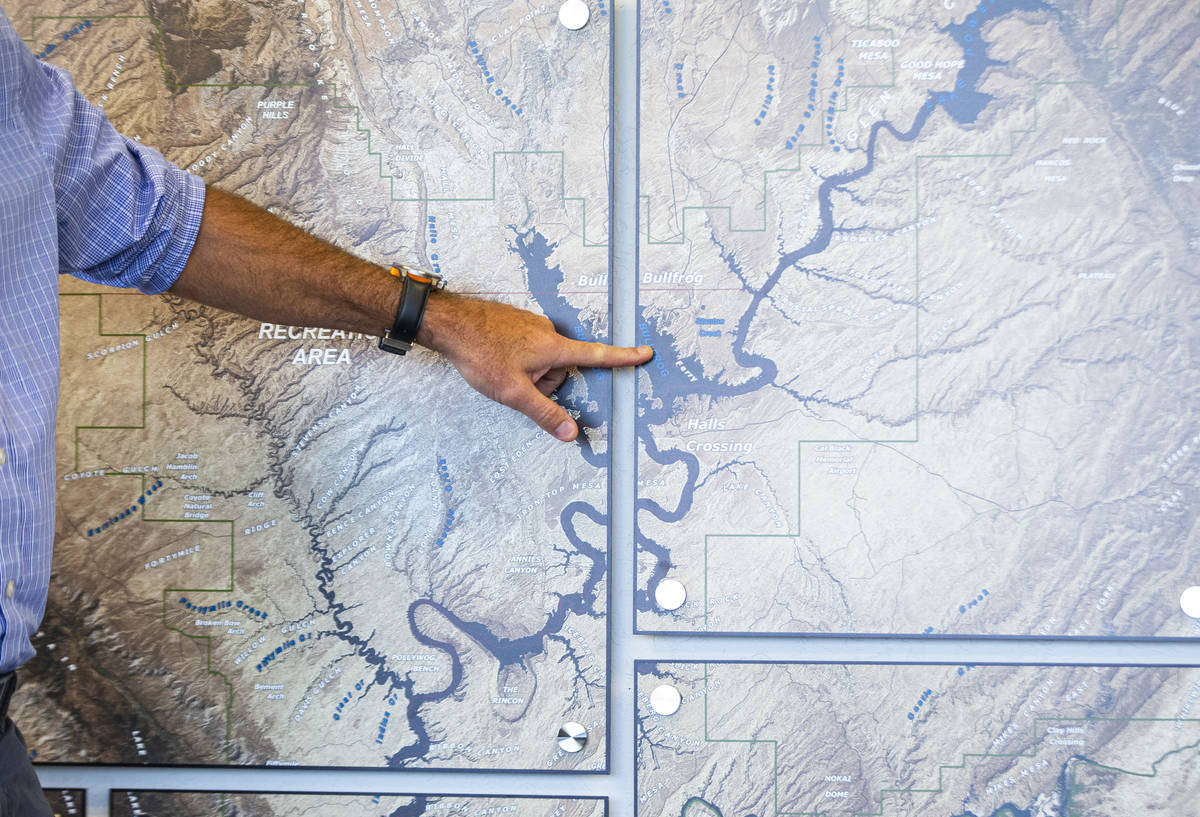 William Shott, superintendent of Glen Canyon National Recreation Area, points to a map while ta ...