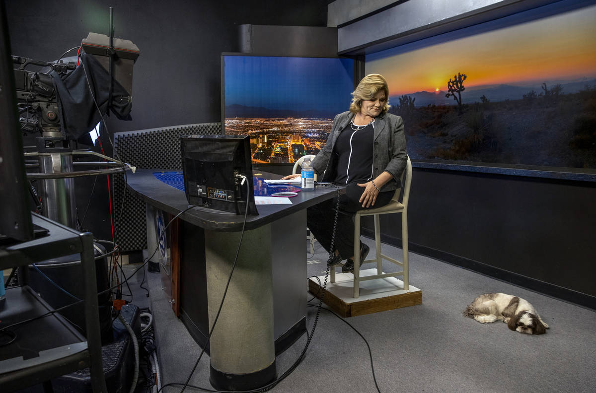 KPVM 25 News Director/Anchor Deanna O'Donnell looks her dog Tommy on set as she preps for her b ...