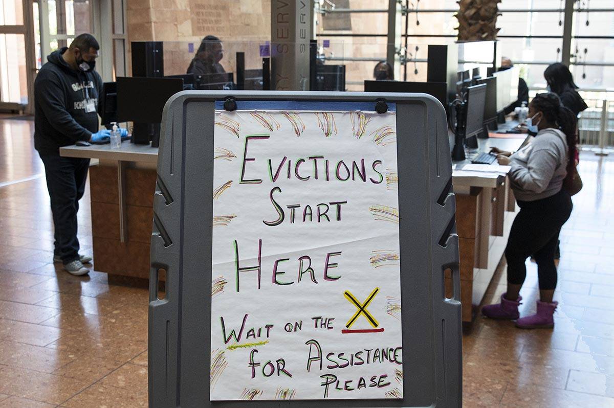 Tenants, who received an eviction notice from their landlord, fill out forms at the Civil Law S ...