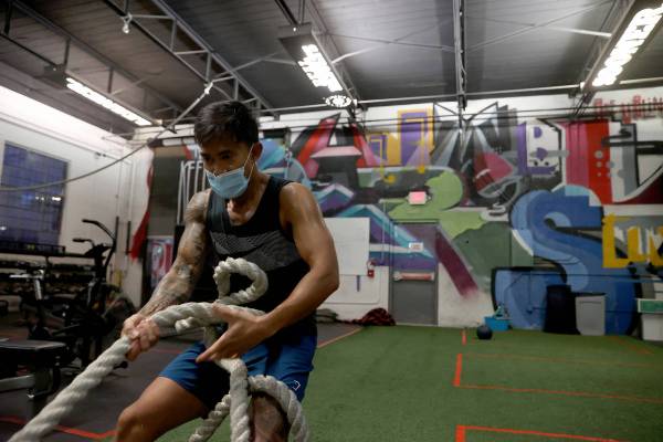 Bong Hidalgo works out at Real Results Fitness gym in downtown Las Vegas on the first day day o ...