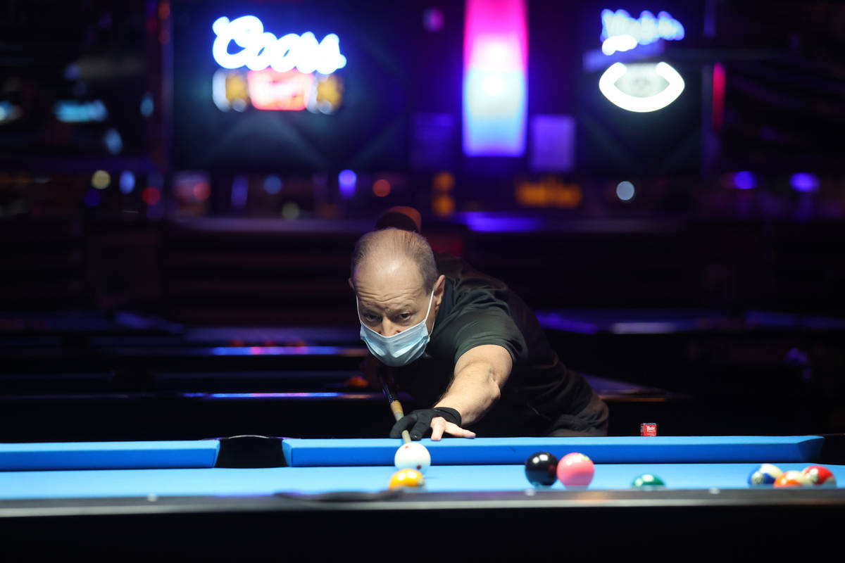 Ross Olfano of Las Vegas plays pool at Griffs Bar & Billiards in Las Vegas on the first day ...