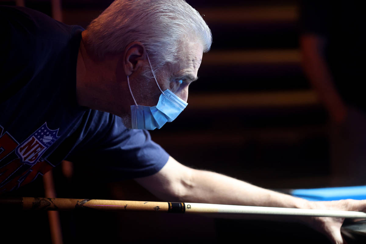 Ron Pniewski of Henderson plays pool at Griffs Bar & Billiards in Las Vegas on the first da ...