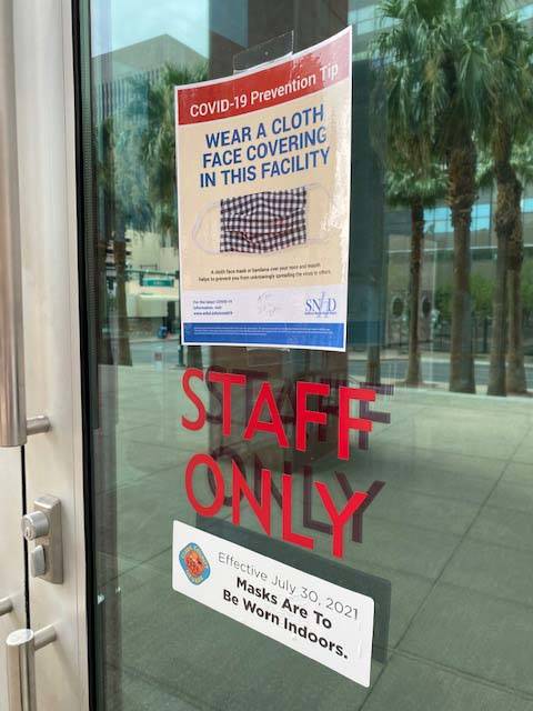 Signs at the Regional Justice Center in Las Vegas asking people to wear masks inside the buildi ...