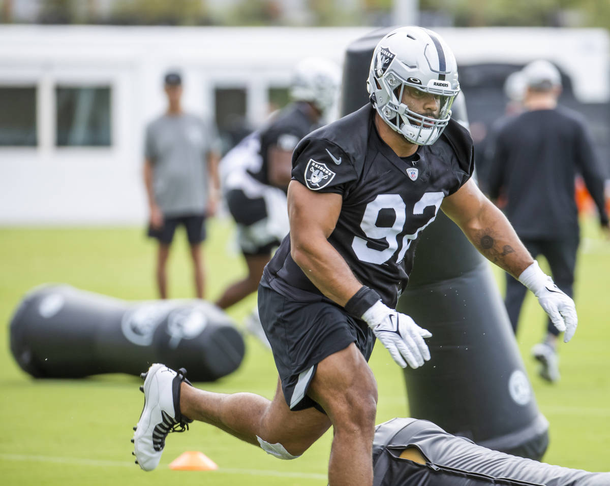 Raiders defensive end Solomon Thomas (92) knocks down an obstacle during training camp at the I ...