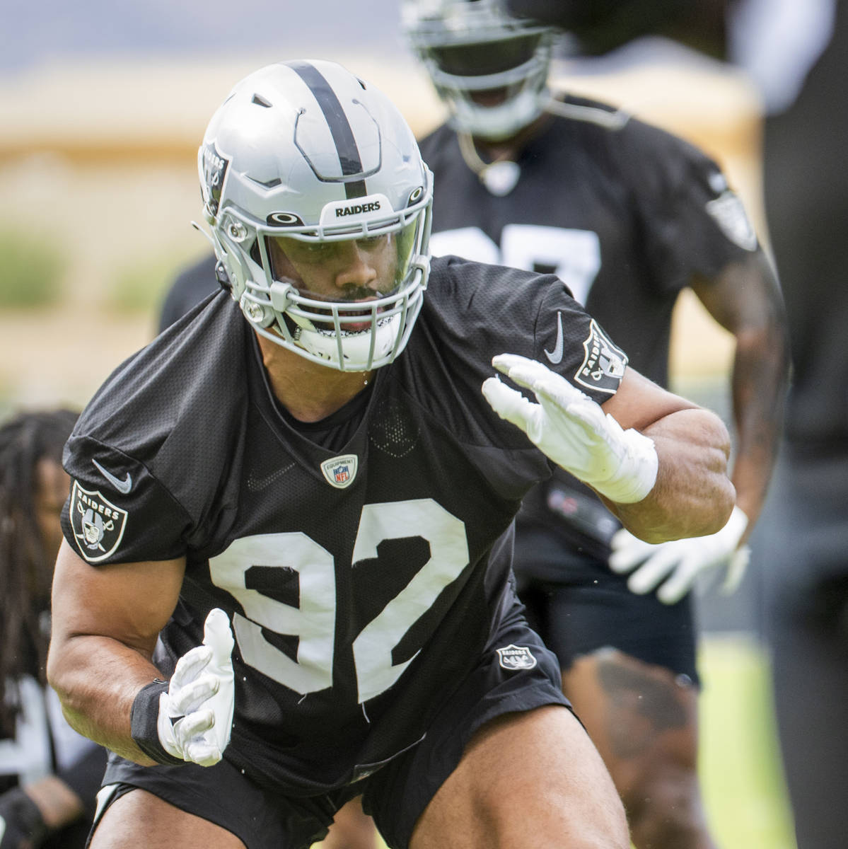 Raiders defensive end Solomon Thomas (92) gets low during a drill in training camp at the Inter ...