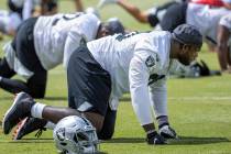 Offensive tackle Alex Leatherwood stretches during a Las Vegas Raiders open practice at the Int ...